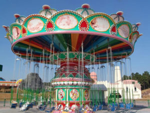 What is the benefit of investing in a rotating flying chair in the park?